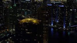 5K aerial stock footage of rooftops of Brickell Key skyscrapers at night in Downtown Miami, Florida Aerial Stock Footage | AX0023_150E