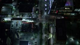 5K aerial stock footage fly over tower and tilt to bird's eye of Brickell Avenue at night in Downtown Miami, Florida Aerial Stock Footage | AX0023_161E