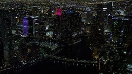 5K aerial stock footage of Brickell Key Drive Bridge and skyscrapers at night in Downtown Miami, Florida Aerial Stock Footage | AX0023_178E