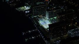 5K aerial stock footage approach waterfront apartment buildings at night in Downtown Miami, Florida Aerial Stock Footage | AX0023_181E