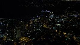 5K aerial stock footage of passing office buildings at night in Coconut Grove, Florida Aerial Stock Footage | AX0023_186