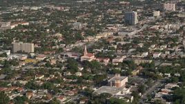 5K aerial stock footage of flying by a church and homes in Coral Way, Florida Aerial Stock Footage | AX0024_027