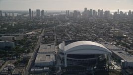 5K aerial stock footage tilt from Marlins Park revealing Downtown Miami skyline, Florida Aerial Stock Footage | AX0024_033