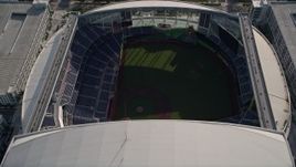 5K aerial stock footage of approaching Marlins Park, tilt to bird's eye of stadium in Miami, Florida Aerial Stock Footage | AX0024_034E
