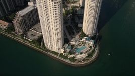 5K aerial stock footage of pool area between condominium complexes on Brickell Key, Downtown Miami, Florida Aerial Stock Footage | AX0024_043