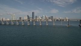 5K aerial stock footage tilt from Biscayne Bay to reveal Rickenbacker Causeway, Downtown Miami, Florida Aerial Stock Footage | AX0024_052E