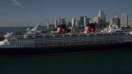 5K aerial stock footage of approaching and flying by Disney Cruise Ship at Port of Miami, Miami, Florida Aerial Stock Footage | AX0024_066E