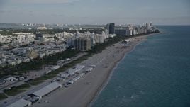 5K aerial stock footage of flying over the beach, approaching South Beach hotels, Miami Beach, Florida Aerial Stock Footage | AX0024_078E
