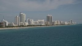 5K aerial stock footage of flying by hotels along the shore, Miami Beach, Florida Aerial Stock Footage | AX0024_082E