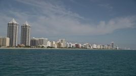 5K aerial stock footage of flying by the Blue and Green Diamonds, hotels, apartments, Miami Beach, Florida Aerial Stock Footage | AX0024_085