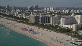 5K aerial stock footage of flying along the shore of South Beach and passing hotels, Miami Beach, Florida Aerial Stock Footage | AX0024_093