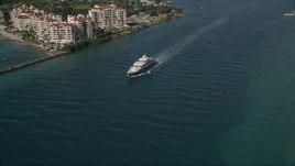 5K aerial stock footage of flying by a yacht on Government Cut, Miami Beach, Florida Aerial Stock Footage | AX0024_098