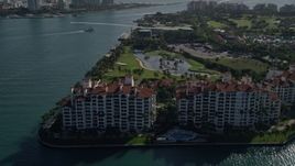 5K aerial stock footage of orbiting condominiums on the shore, Fisher Island, Florida Aerial Stock Footage | AX0024_101