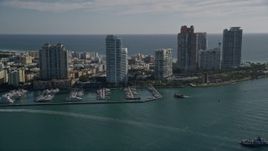 5K aerial stock footage of approaching Miami Beach Marina, skyscrapers in South Beach, Miami Beach, Florida Aerial Stock Footage | AX0024_102