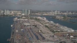 5K aerial stock footage of flying by Port of Miami and a Disney cruise ship, Miami, Florida Aerial Stock Footage | AX0024_117