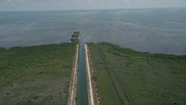 5K aerial stock footage of orbiting canal to Atlantic Ocean in Mangrove Preserve, Homestead, Florida Aerial Stock Footage | AX0025_012