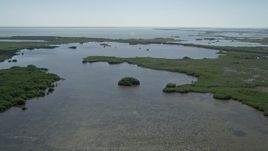 5K aerial stock footage of flying over coastal lagoon, Homestead, Florida Aerial Stock Footage | AX0025_031