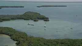 5K aerial stock footage of flying by lagoon, fishing and sail boats, Model Lands Basin, Homestead, Florida Aerial Stock Footage | AX0025_044