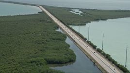 5K aerial stock footage of tracking light traffic on Overseas Highway, Key Largo, Florida Aerial Stock Footage | AX0025_046E