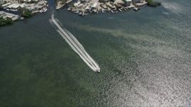 5K aerial stock footage of homes on Lake Surprise, track speedboat on Sexton Cove, Key Largo, Florida Aerial Stock Footage | AX0025_057