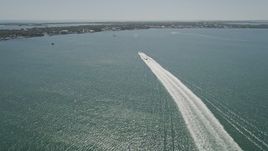 5K aerial stock footage of following two boats racing to shore across Blackwater Sound, Key Largo, Florida Aerial Stock Footage | AX0025_059