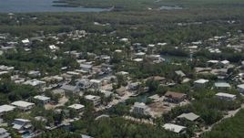 5K aerial stock footage of flying by homes on canals, Key Largo, Florida Aerial Stock Footage | AX0025_062