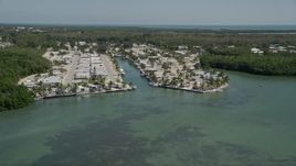 5K aerial stock footage of flying by Calusa Camp Resort by Buttonwood Sound, Key Largo, Florida Aerial Stock Footage | AX0025_066