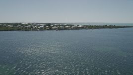 5K aerial stock footage of flying by homes on Buttonwood Sound, Key Largo, Florida Aerial Stock Footage | AX0025_070
