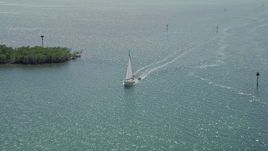 5K aerial stock footage of flying by a sailboat in Buttonwood Sound, Key Largo, Florida Aerial Stock Footage | AX0025_071