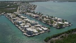 5K aerial stock footage video of flying over homes on the shore, Tavernier, Florida Aerial Stock Footage | AX0025_086