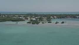 5K aerial stock footage of approaching homes on the shore, Tavernier, Florida Aerial Stock Footage | AX0025_099