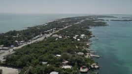 5K aerial stock footage of following Overseas Highway, revealing Upper Matecumbe Key, Islamorada, Florida Aerial Stock Footage | AX0025_110E