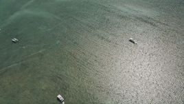 5K aerial stock footage bird's eye of fishing boats and catamarans off the shore, Islamorada, Florida Aerial Stock Footage | AX0025_115