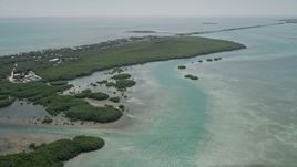 5K aerial stock footage of following a dredge to approach mangroves near coast, Islamorada, Florida Aerial Stock Footage | AX0025_116