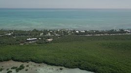 5K aerial stock footage of flying by Resorts and Marinas along the shore, Islamorada, Florida Aerial Stock Footage | AX0025_117
