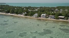 5K aerial stock footage of oceanfront homes on the coast in Islamorada, Florida Aerial Stock Footage | AX0025_125