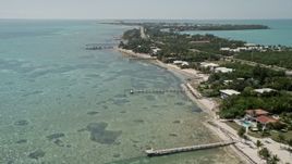 5K aerial stock footage of flying by homes on the coast, Islamorada, Florida Aerial Stock Footage | AX0025_126E