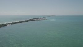 5K aerial stock footage tilt from open water revealing homes on Long Key, Layton, Florida Aerial Stock Footage | AX0025_141