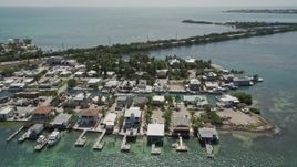 5K aerial stock footage of flying by small neighborhood on Conch Key, Marathon, Florida Aerial Stock Footage | AX0025_147