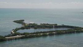 5K aerial stock footage of flying by Conch Key Cottages, Little Conch Key, Marathon, Florida Aerial Stock Footage | AX0025_148