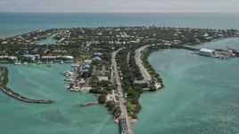5K aerial stock footage of flying by homes on Duck Key, Marathon, Florida Aerial Stock Footage | AX0025_150