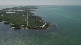 5K aerial stock footage of approaching homes on the shore of Grassy Key, Marathon, Florida Aerial Stock Footage | AX0025_154