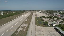 5K aerial stock footage of lifting off from Florida Keys Marathon Airport, Marathon, Florida Aerial Stock Footage | AX0026_001