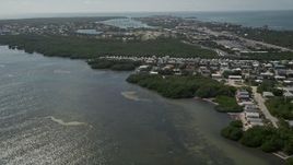 5K aerial stock footage of following coast, approaching Sombrero Country Club, Marathon, Florida Aerial Stock Footage | AX0026_006