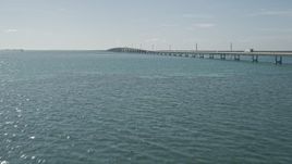 5K aerial stock footage of flying by light traffic on the Seven Mile Bridge, Florida Aerial Stock Footage | AX0026_021E