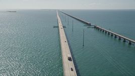 5K aerial stock footage fly over Atlantic Ocean, reveal light traffic on Seven Mile Bridge, Florida Aerial Stock Footage | AX0026_023