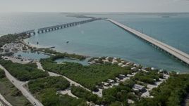 5K aerial stock footage fly over RV park, approach sunbathers on beach, Bahai Honda Key, Florida Aerial Stock Footage | AX0026_038
