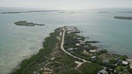 5K aerial stock footage of approaching homes and small marina, Big Pine Key, Florida Aerial Stock Footage | AX0026_049E