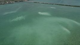 5K aerial stock footage of flying over murky water off the shore of Little Torch Key, Florida Aerial Stock Footage | AX0026_051