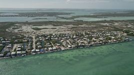 5K aerial stock footage of flying over homes along the shore, wetlands, Little Torch Key, Florida Aerial Stock Footage | AX0026_052